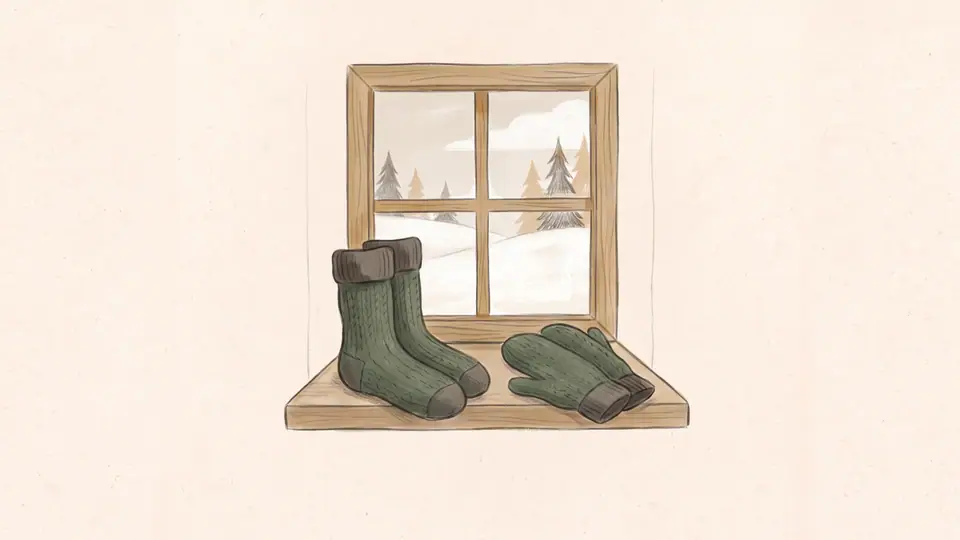 Illustration of wool socks and mittens beside a window in winter.
