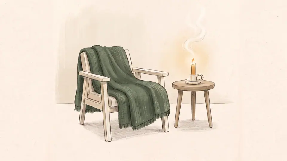 Illustration of a cosy room with a candle and a soft blanket.
